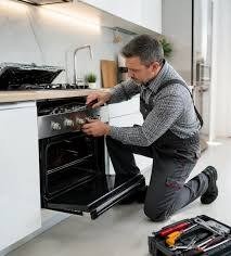 Electric stove repair technician in Abilene Texas repairing an oven and stove