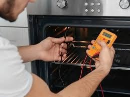 Dishwasher repair technician fixing dishwasher in Abilene TX