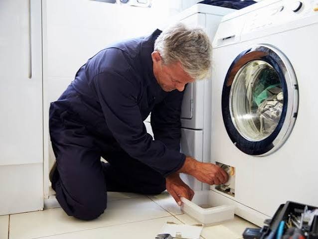 Washer repair in Abilene Texas with technician checking washing machine